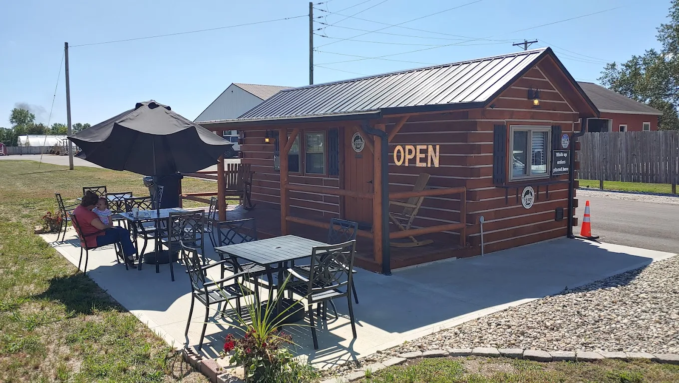 The Coffee Cabin Drive Thru — wood-paneled mobile drive-thru cabin